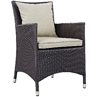 Wicker chair with beige cushions on a white background