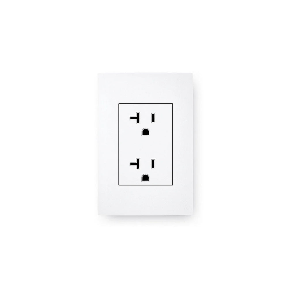 White wall outlet with black socket design on a white background