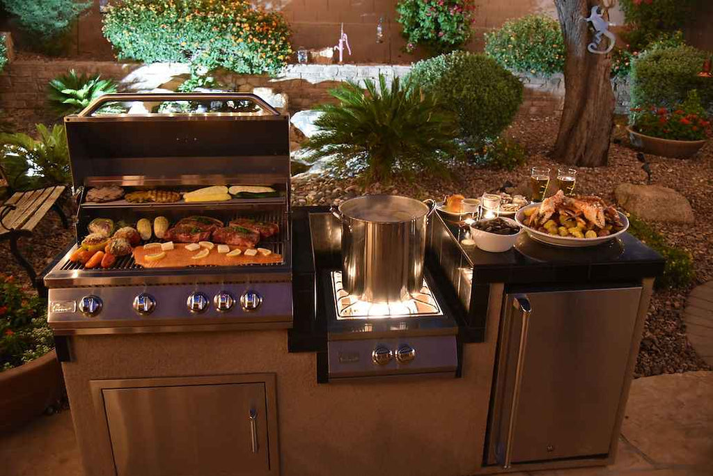KoKoMo outdoor kitchen island featuring stainless steel 4-burner grill and integrated refrigerator