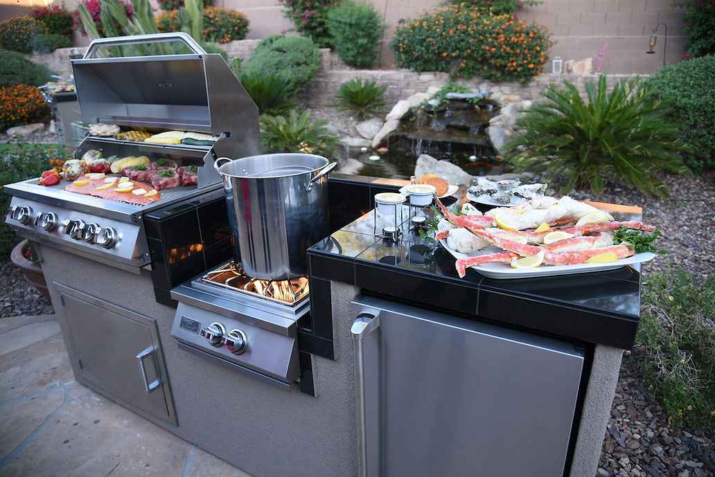 KoKoMo 7'6" BBQ Island with wok burner, grill, and refrigerator — full outdoor kitchen setup
