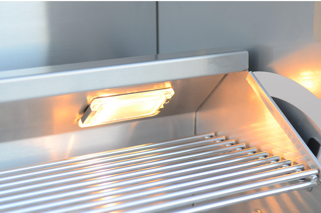 Stainless steel grill with glowing light inside a kitchen cabinet