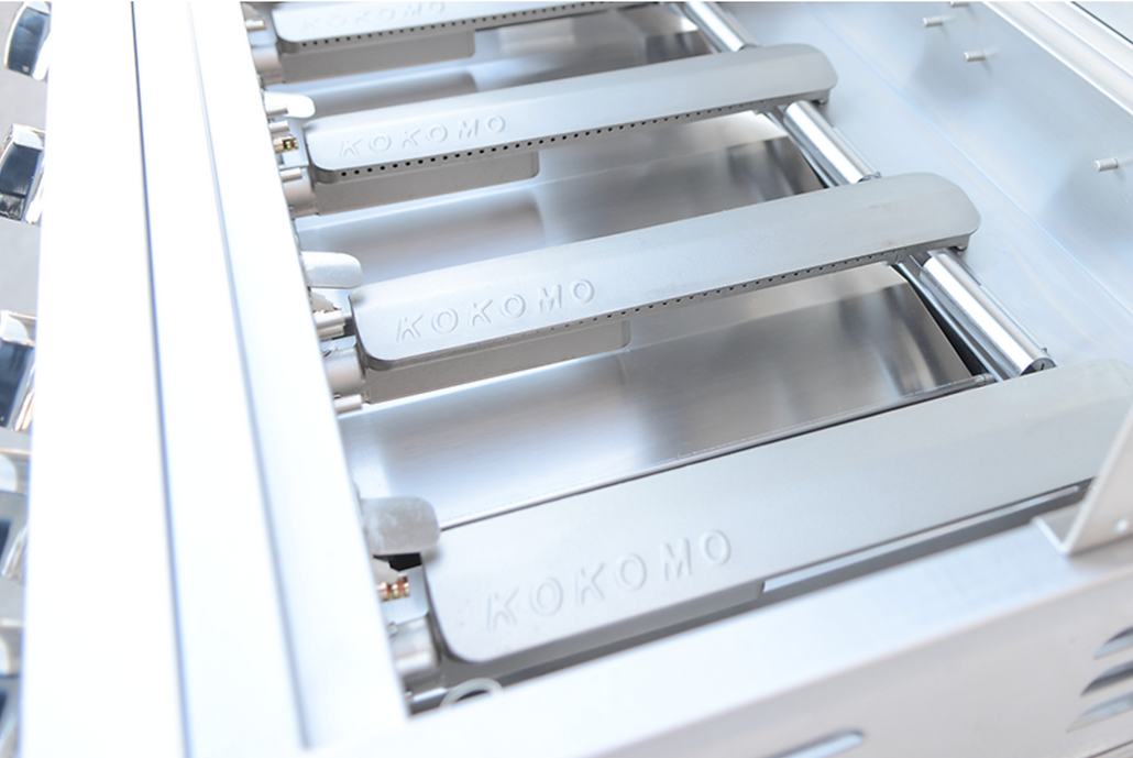 Metallic kitchen component with 'KOKOMO' branding on a white background