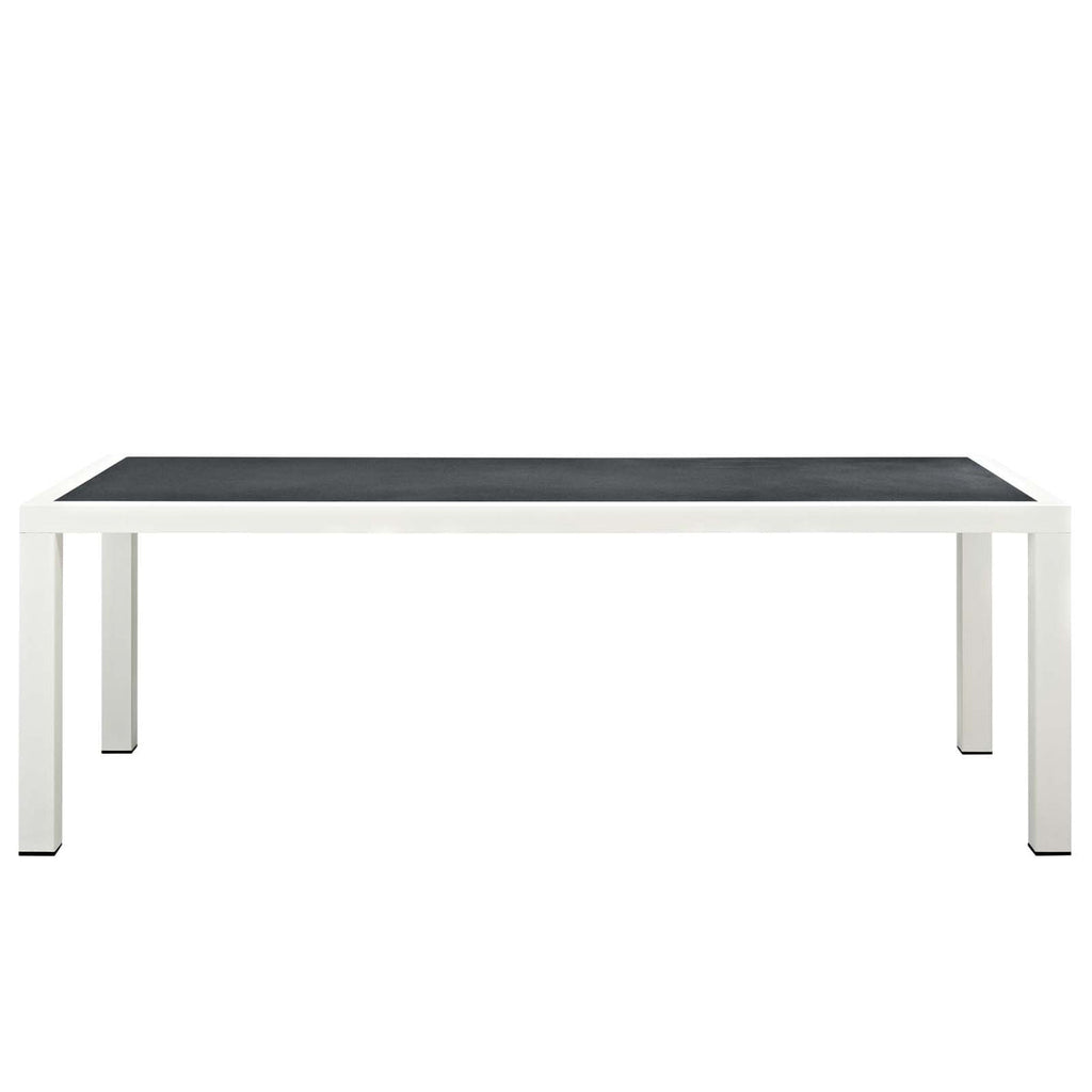 Rectangular table with black top and white legs on a white background