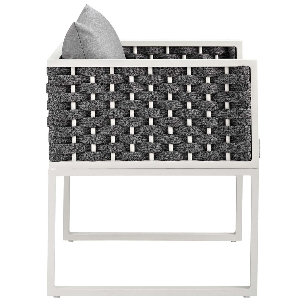 Woven chair with gray cushion on a white background