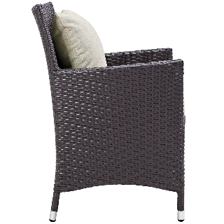 Wicker chair with a cushion on a white background
