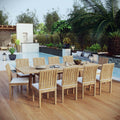 Outdoor dining set with wooden table and chairs on a wooden deck by a pool.