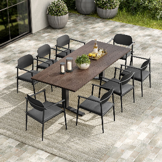 Outdoor dining set with a large table and chairs on a patio.