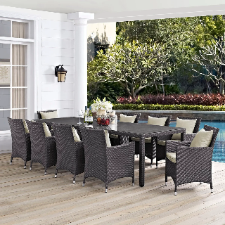 Outdoor patio set with chairs and table by a poolside