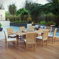 Outdoor dining set with wooden table and chairs on a wooden deck by a pool.