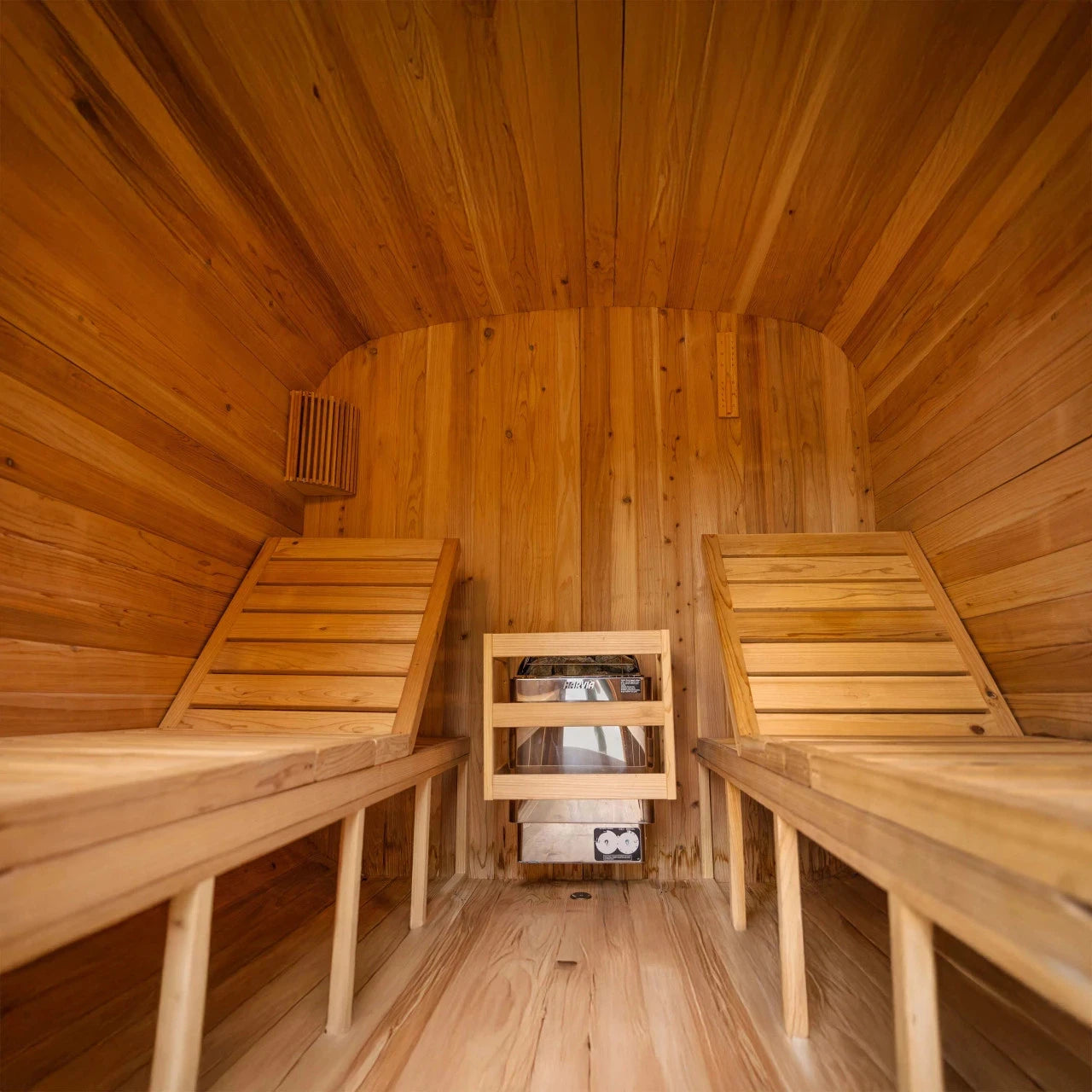 Wooden sauna with two benches and a small shelf.