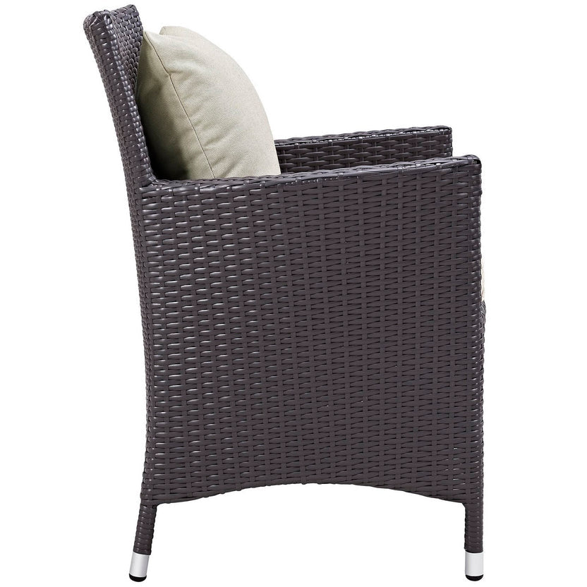 Wicker chair with a cushion on a white background