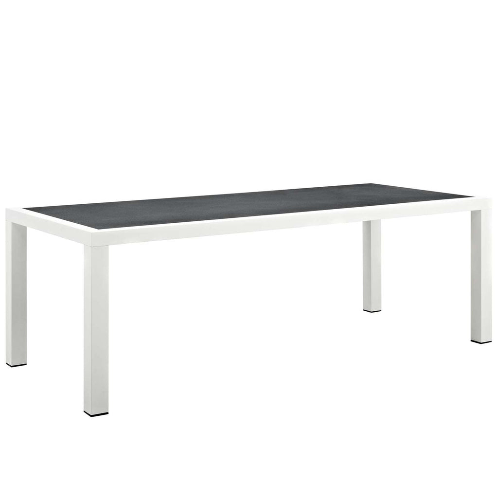 Rectangular table with black top and white legs on a white background