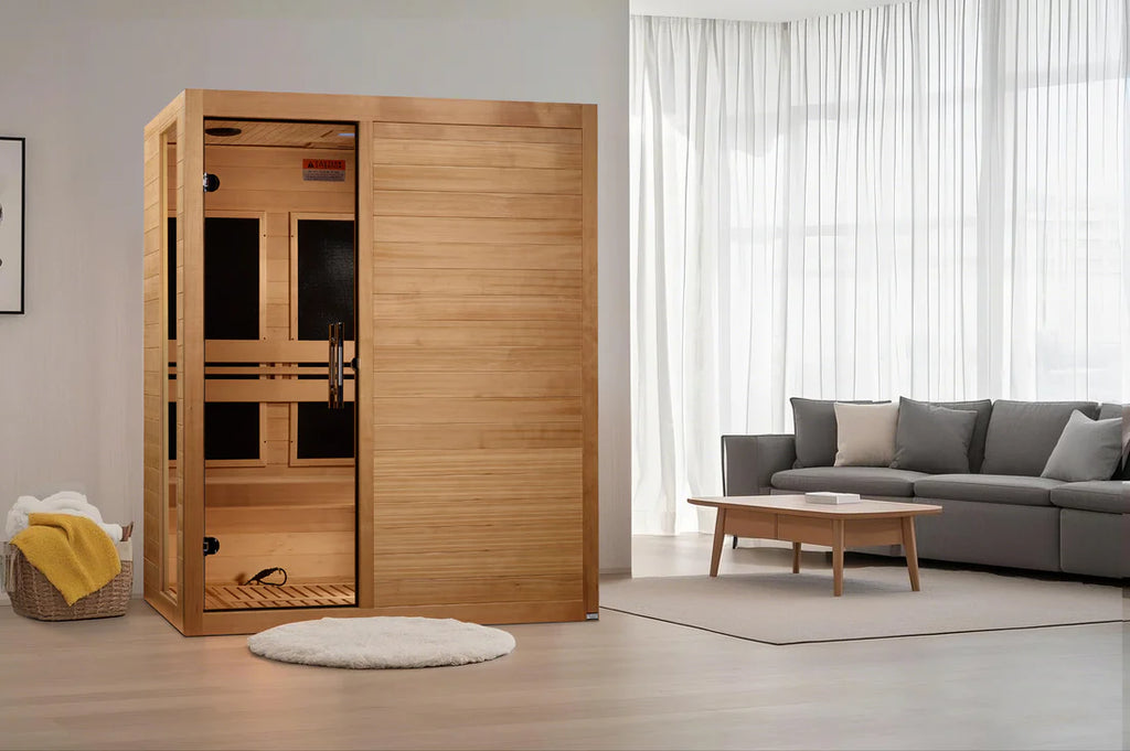 Wooden sauna in a modern living room with a gray sofa and coffee table.