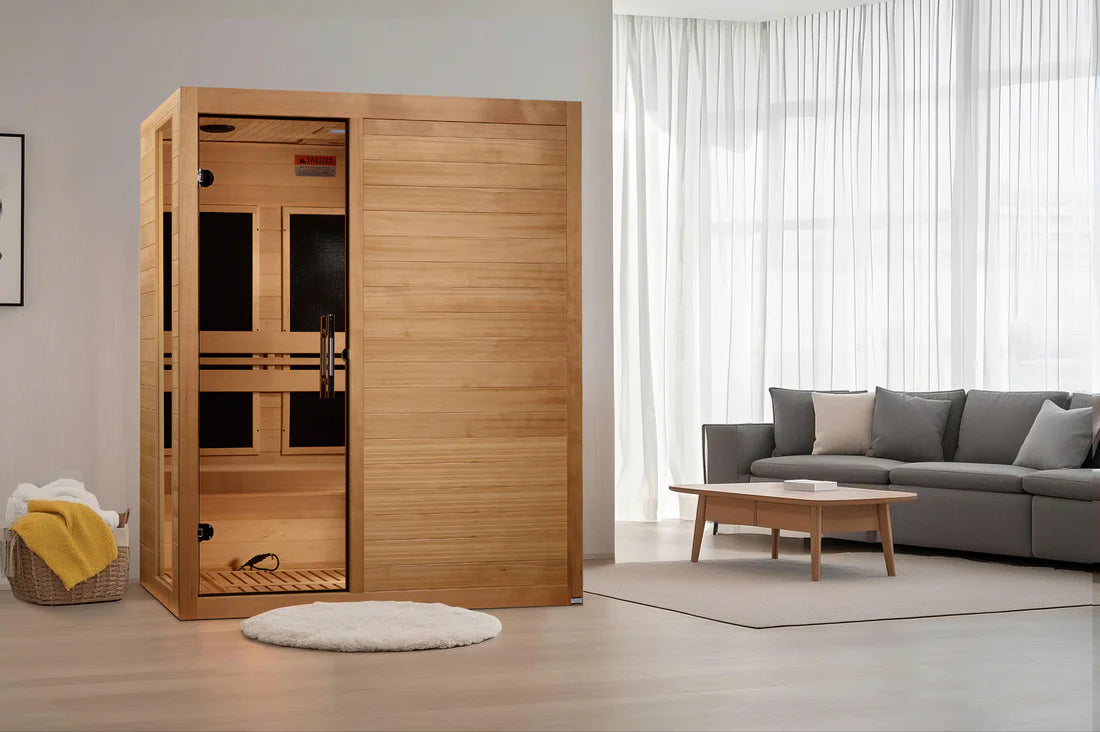 Wooden sauna in a modern living room with a gray sofa and coffee table.
