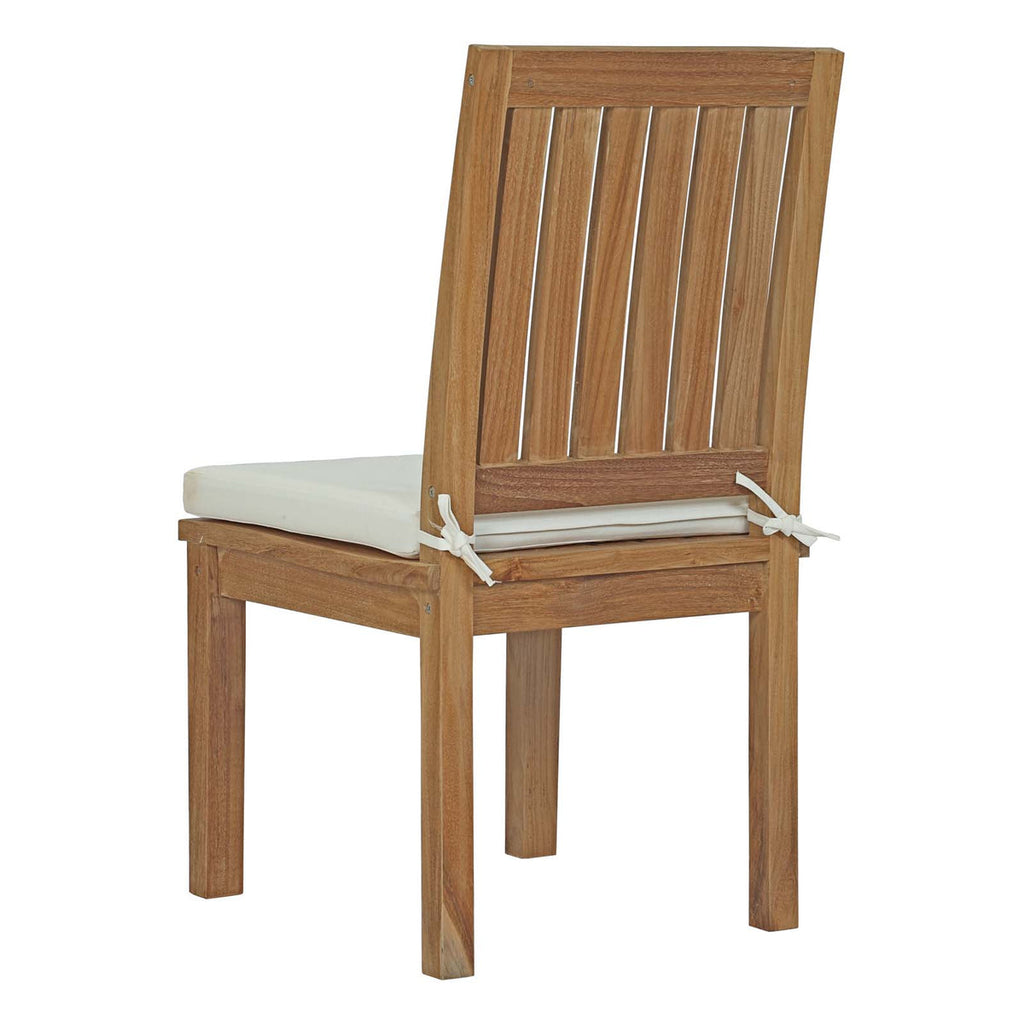 Wooden chair with a white cushion on a white background