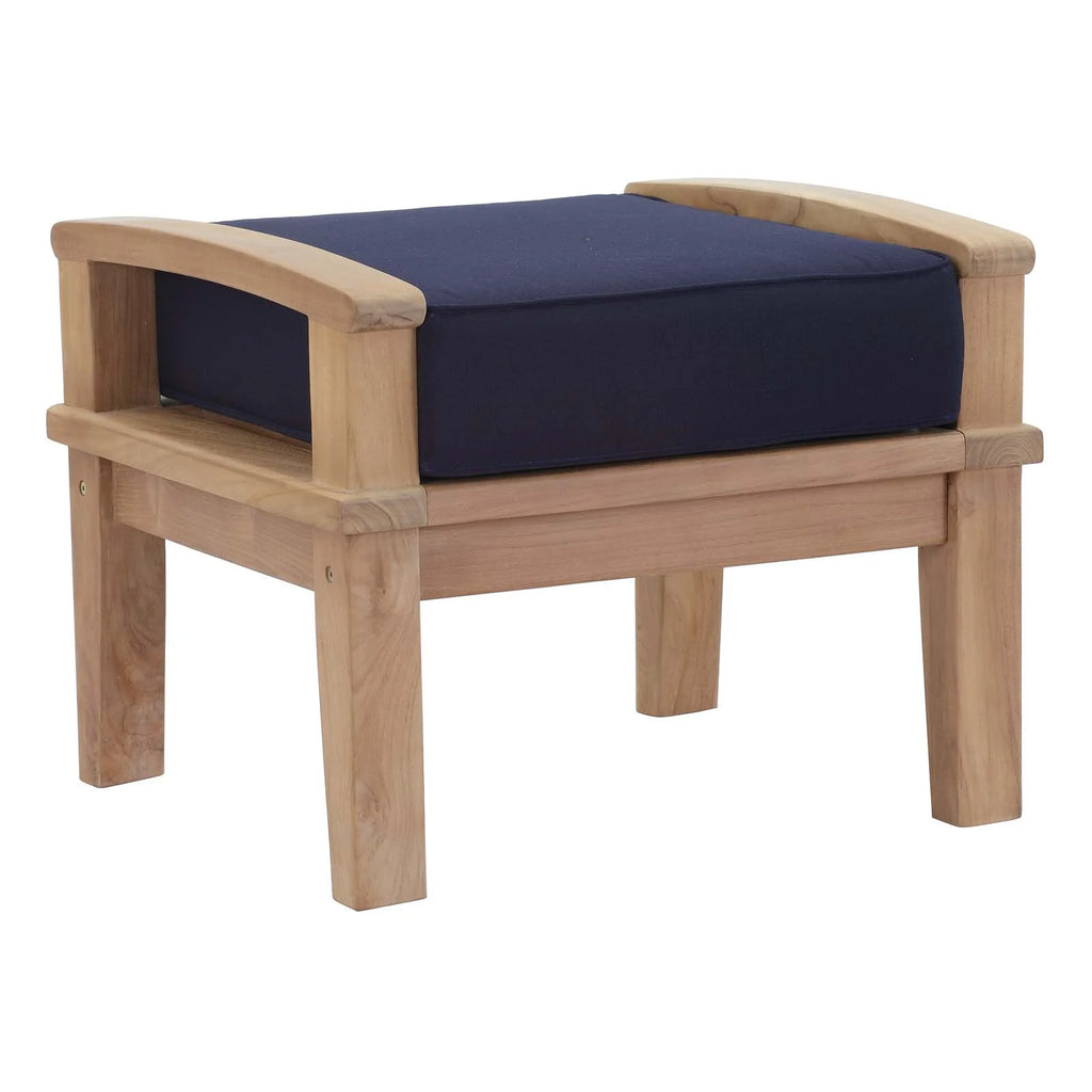 Wooden armchair with a navy cushion on a white background