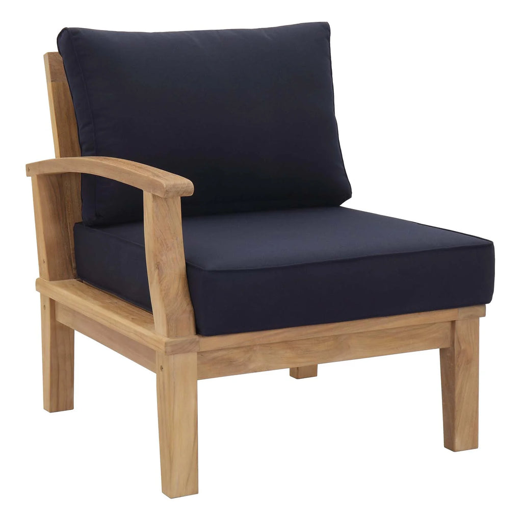 Wooden armchair with navy cushions on a white background