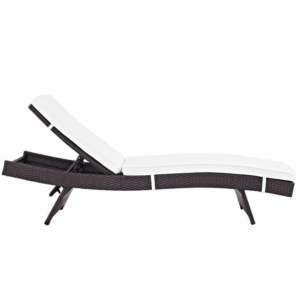 White lounge chair with black woven frame on a white background