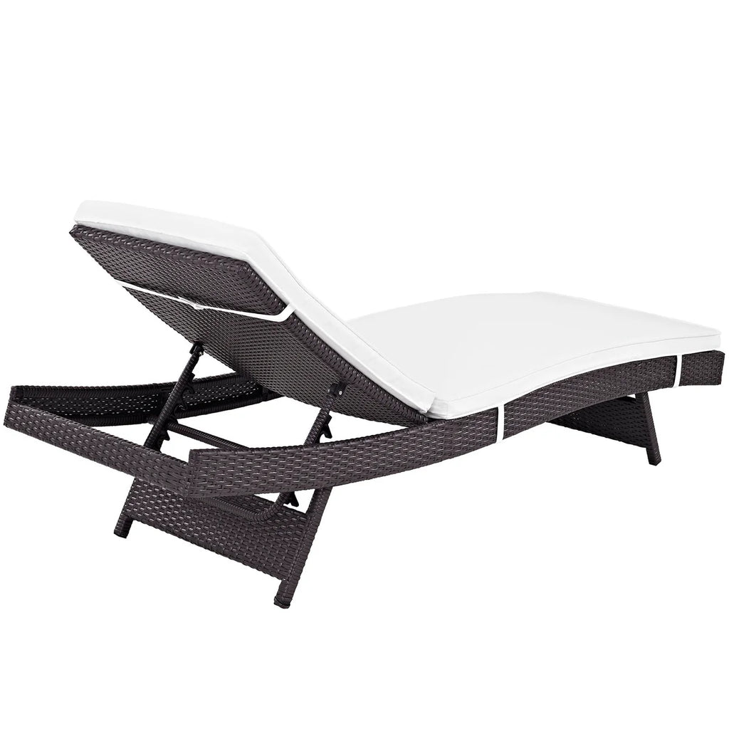 White lounge chair with black woven frame on a white background