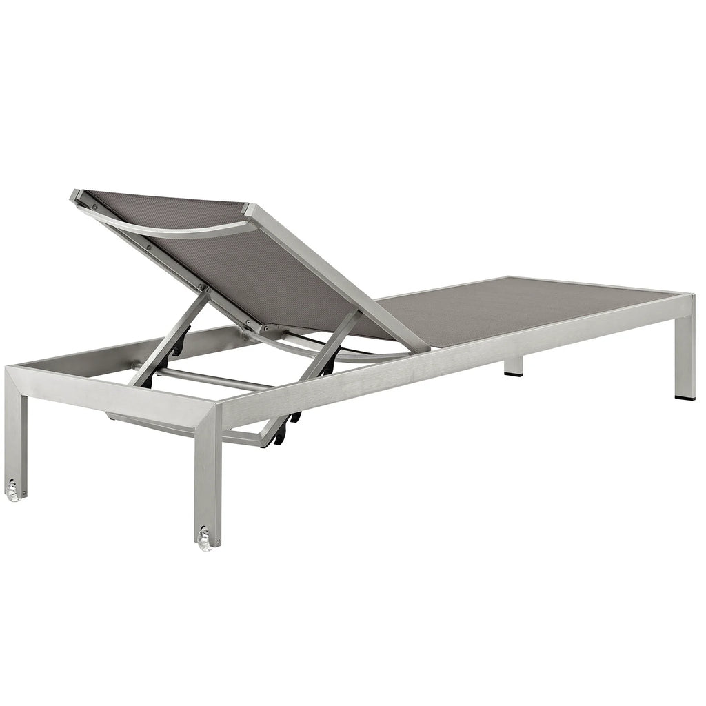 Gray lounge chair with metal frame on a white background