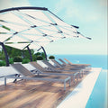 Row of lounge chaise chairs under a canopy by a pool with ocean view