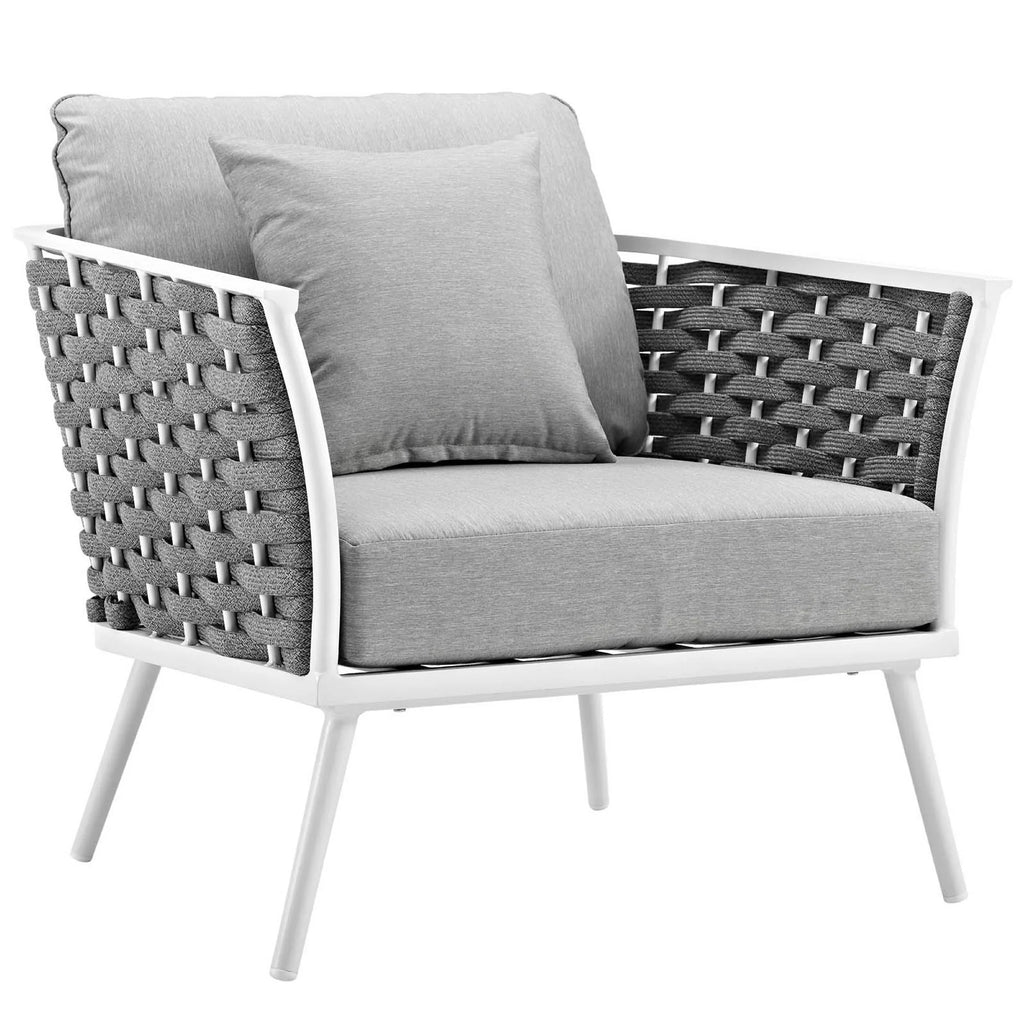 Modern outdoor chair with gray cushions and wicker design on a white background