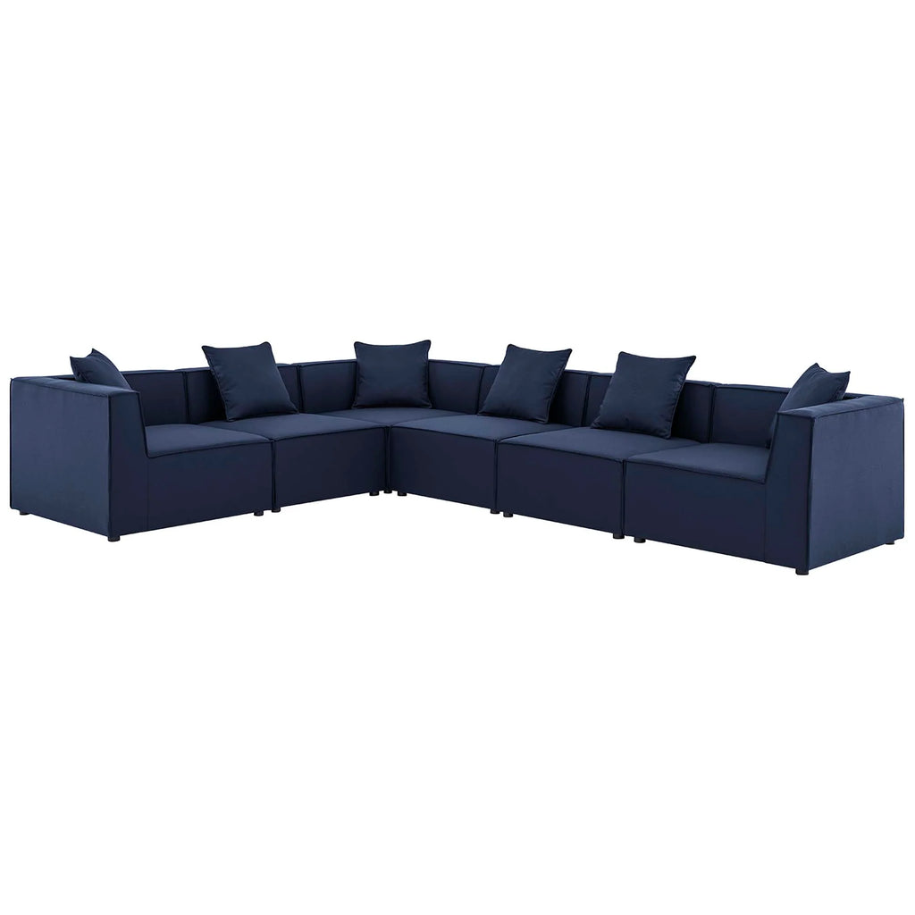 Navy blue sectional sofa with multiple cushions on a white background