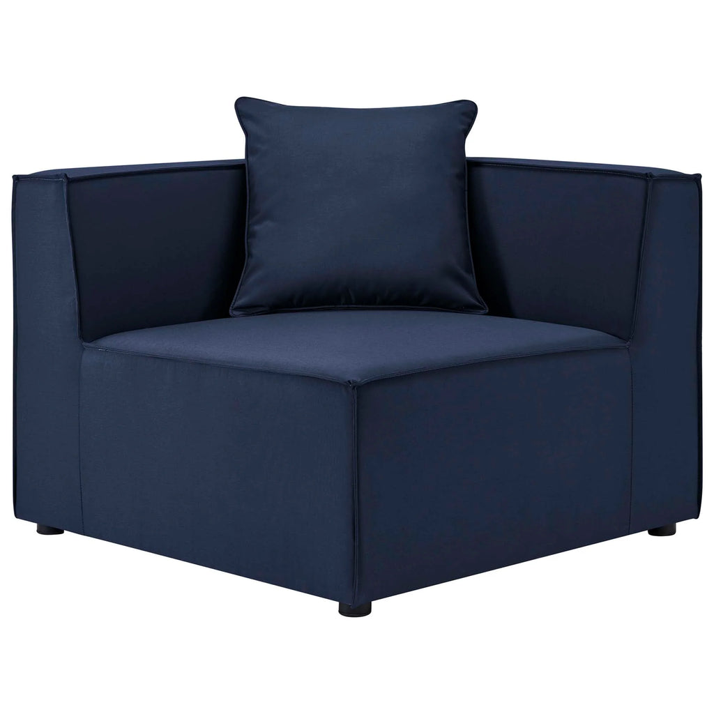 Navy blue armchair with a matching pillow on a white background