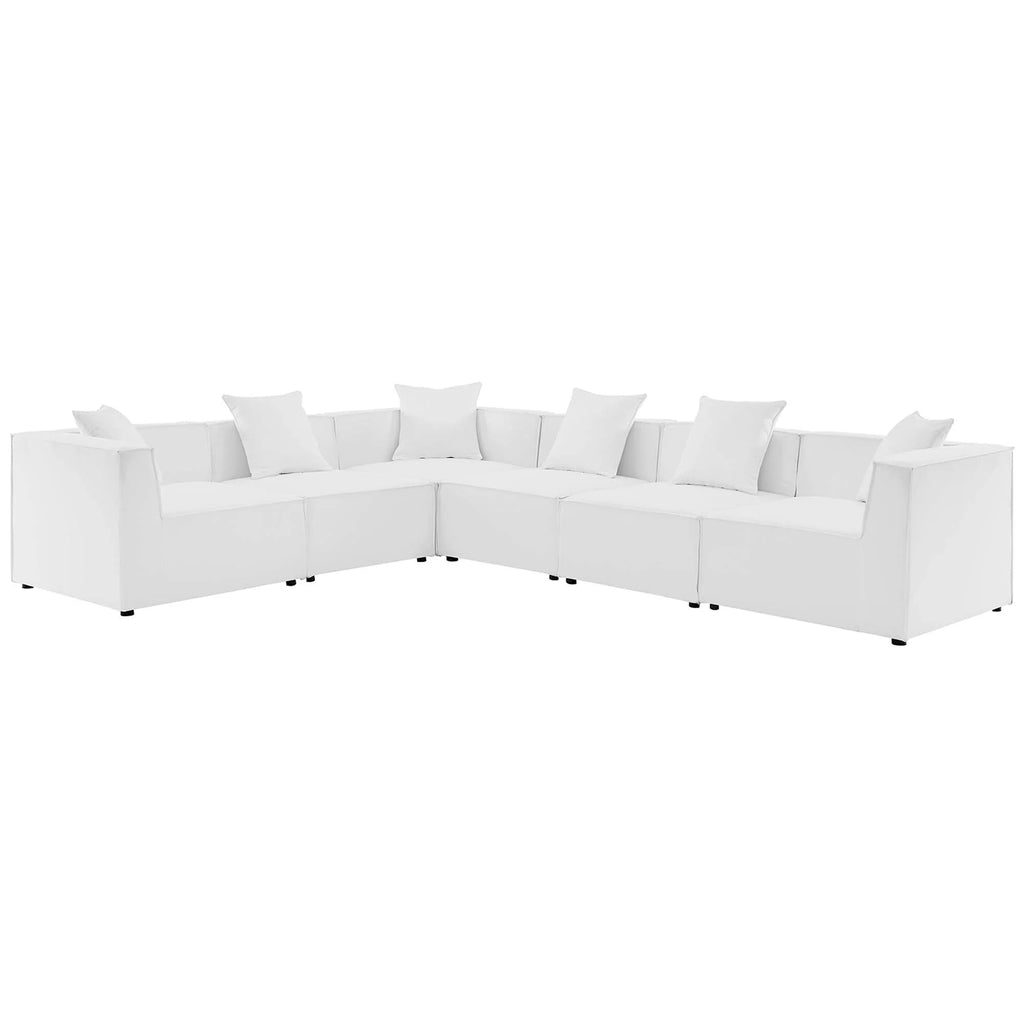 White sectional sofa with multiple cushions on a white background