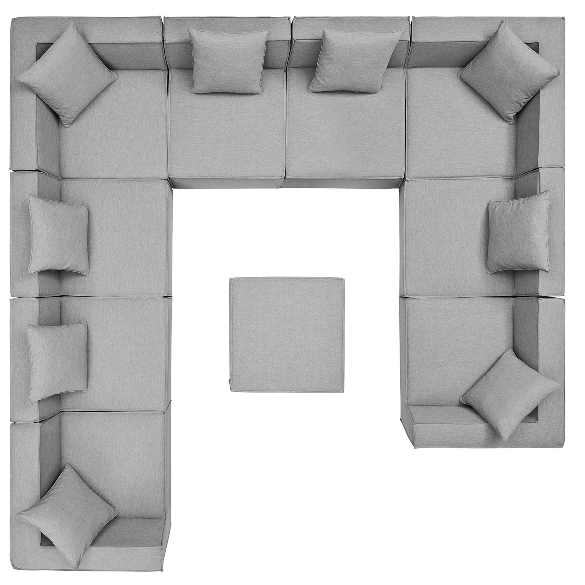 Gray modular sofa with cushions on a white background