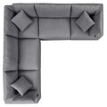 Gray sectional sofa with cushions on a white background