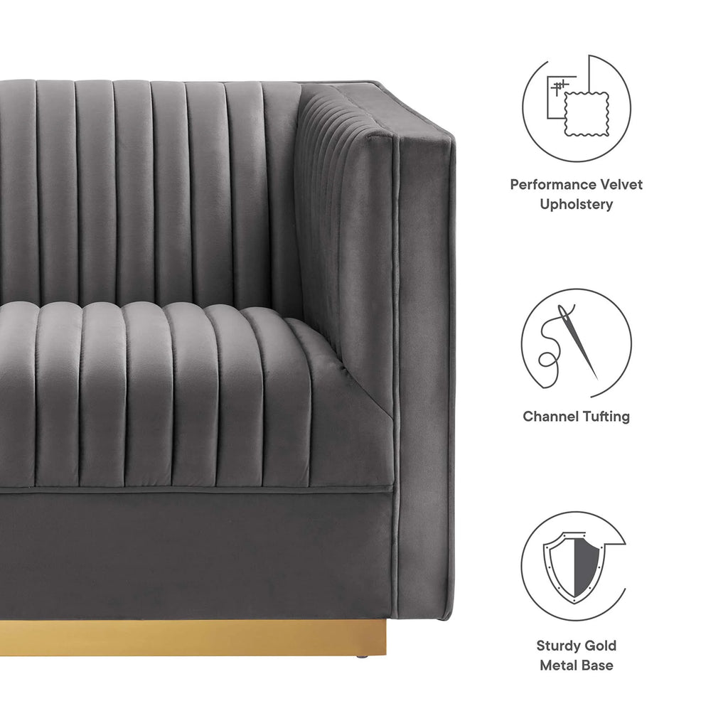 Gray sofa with gold base, featuring icons and text describing material and design elements.