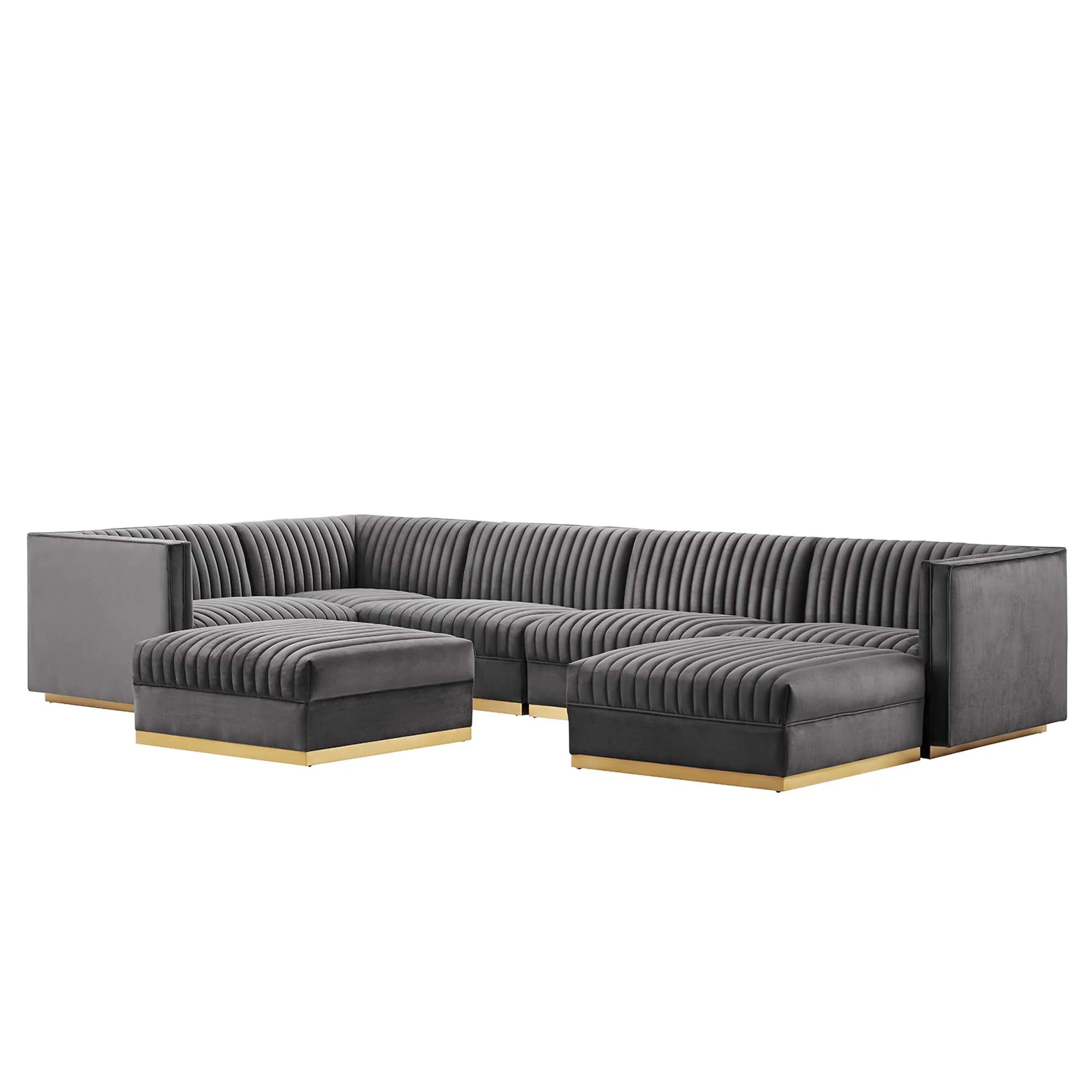 Gray sectional sofa with gold legs on a white background