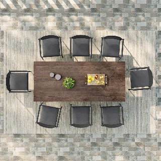 Outdoor dining set with a table and chairs on a stone patio