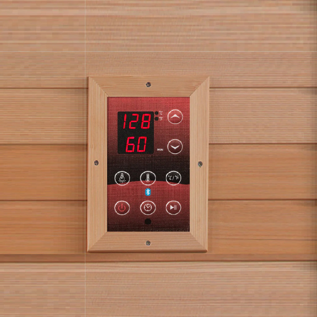 Digital control panel on a wooden wall with temperature display