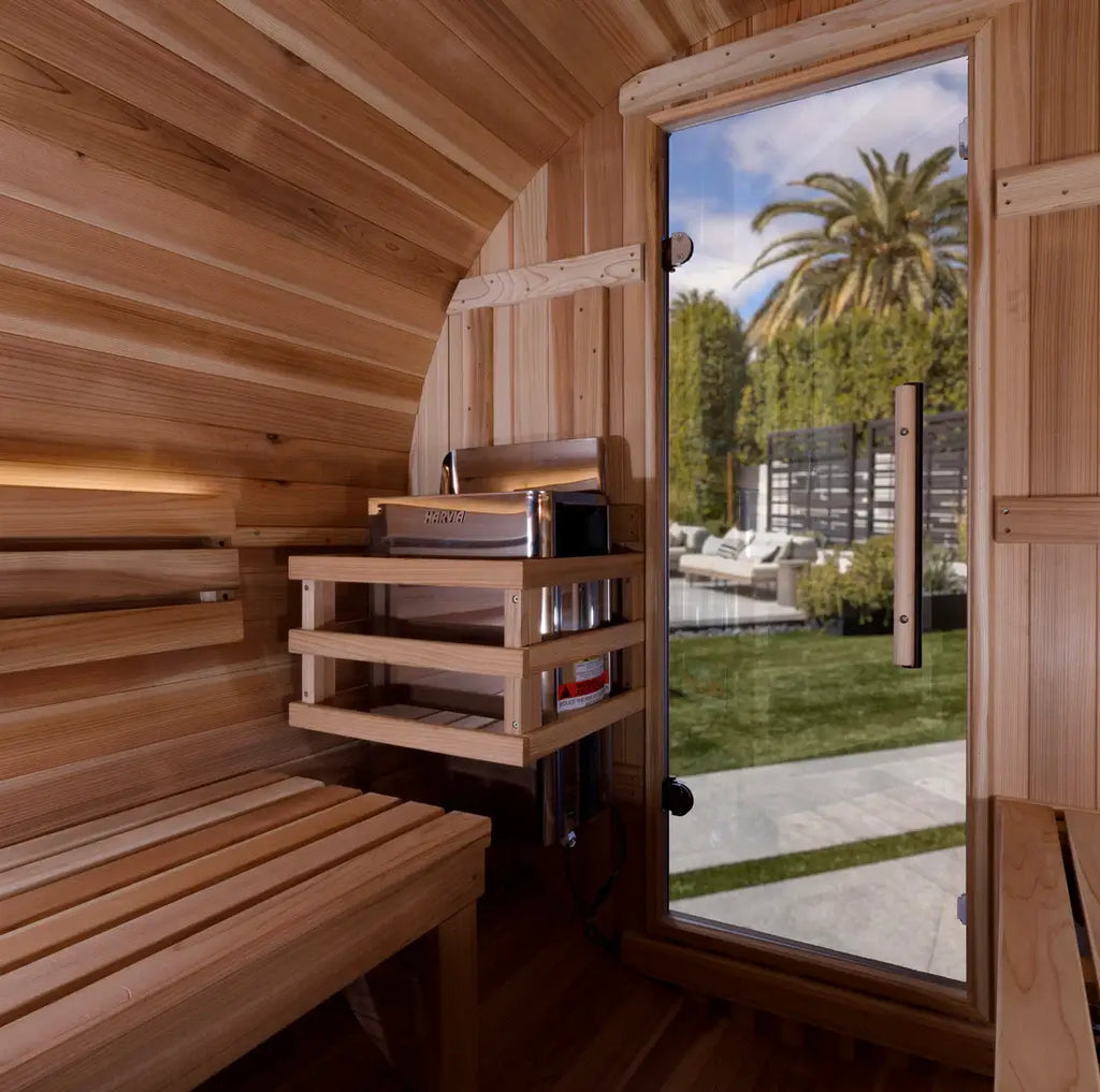 Wooden sauna interior with a view of a garden outside