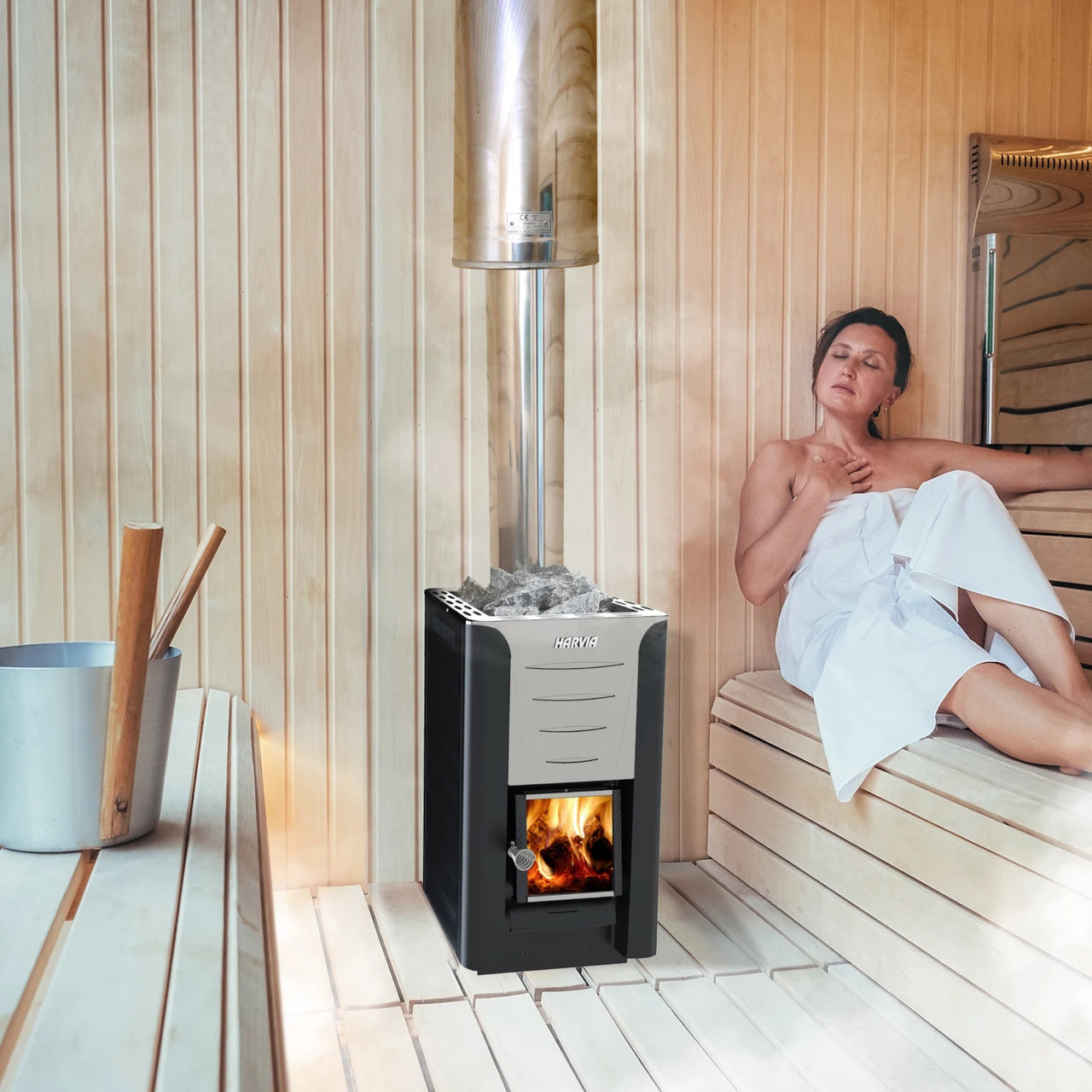 Person relaxing in a sauna with a sauna heater and wooden bench.