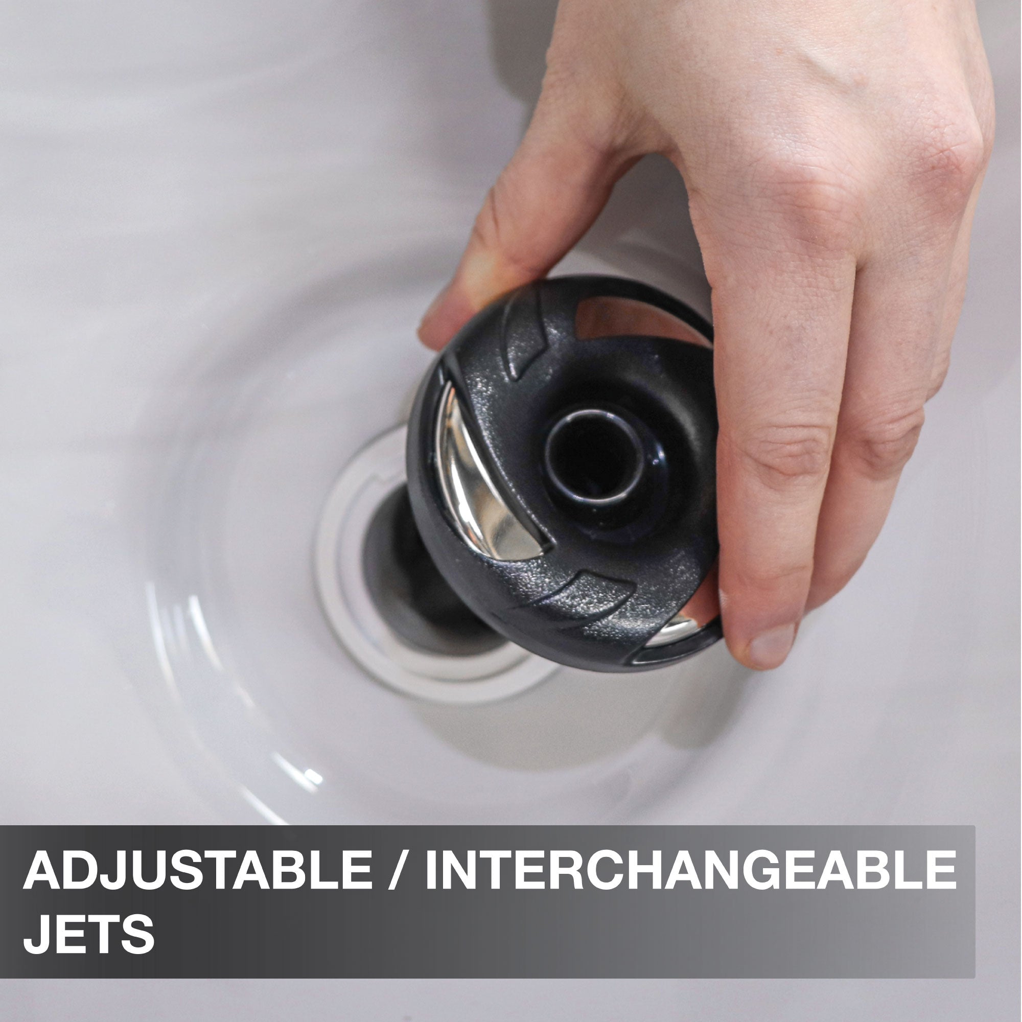 Hand adjusting an adjustable interchangeble jet in a sink