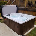Hot tub with water features on a patio area