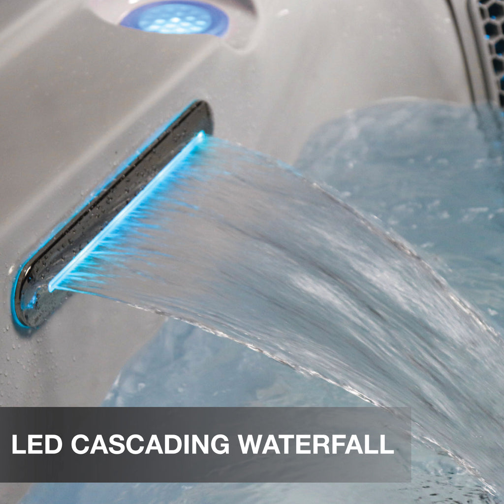 LED cascading waterfall feature in a bathtub with water flowing.
