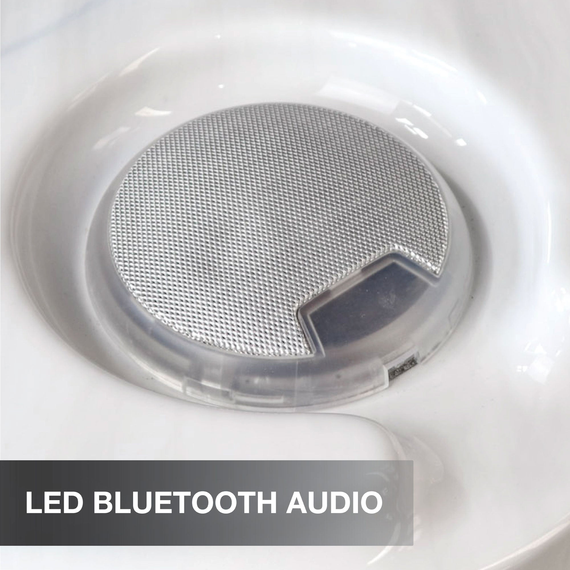 Close-up of a LED Bluetooth audio device with a white background