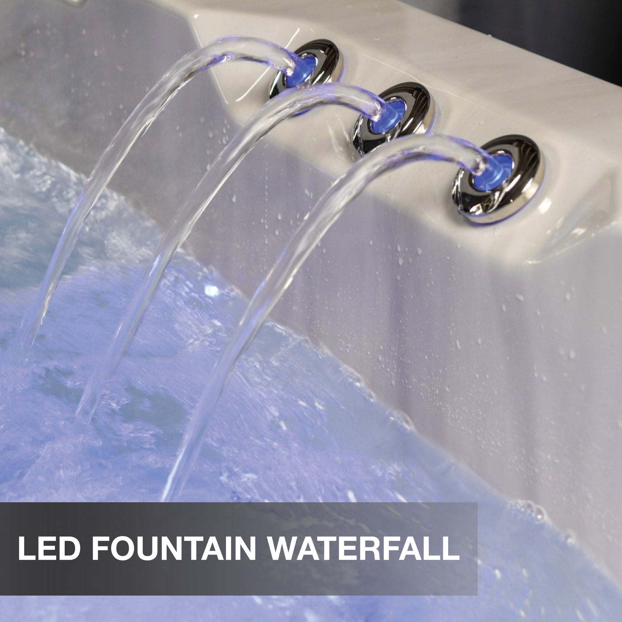 LED fountain waterfall feature in a hot tub with water flowing.