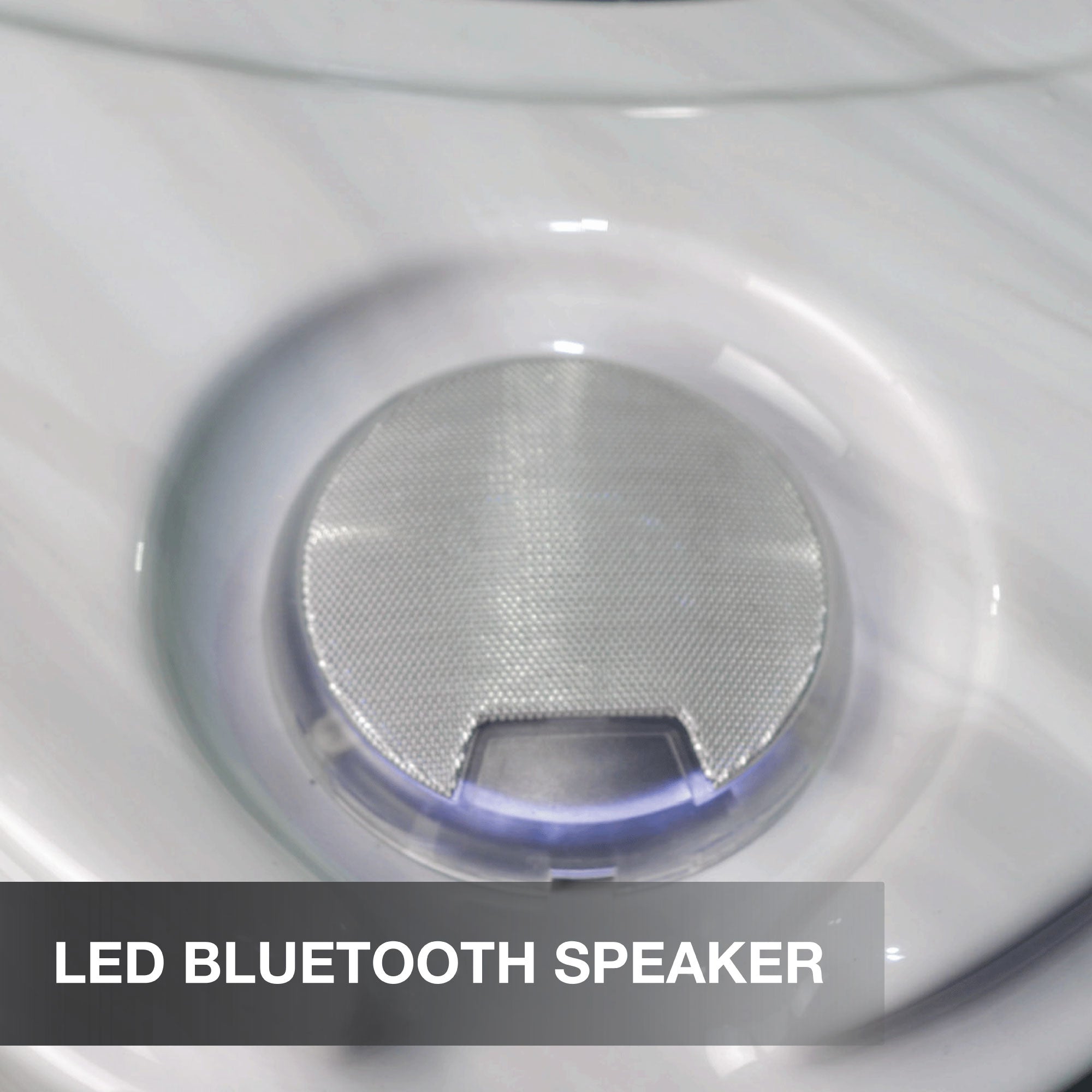 Close-up of an LED Bluetooth speaker with a metallic finish.