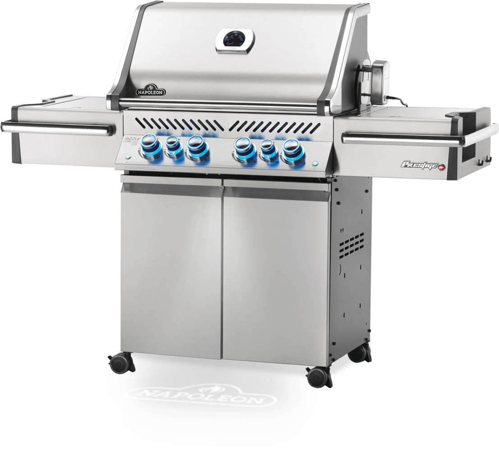 Stainless steel grill with multiple burners on a white background