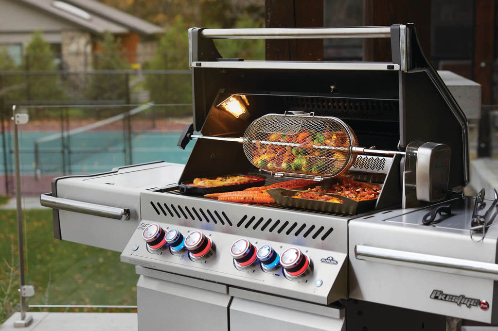 Outdoor grill with food being cooked on a patio