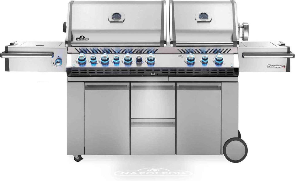 Stainless steel grill with multiple burners on a white background