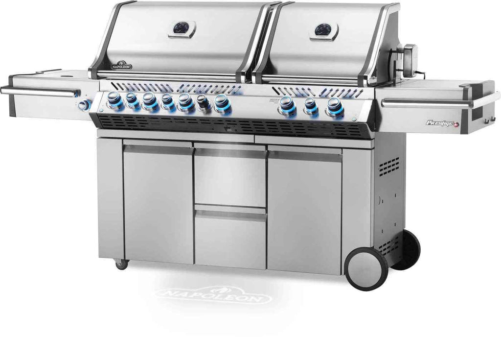 Stainless steel grill with multiple burners on a white background