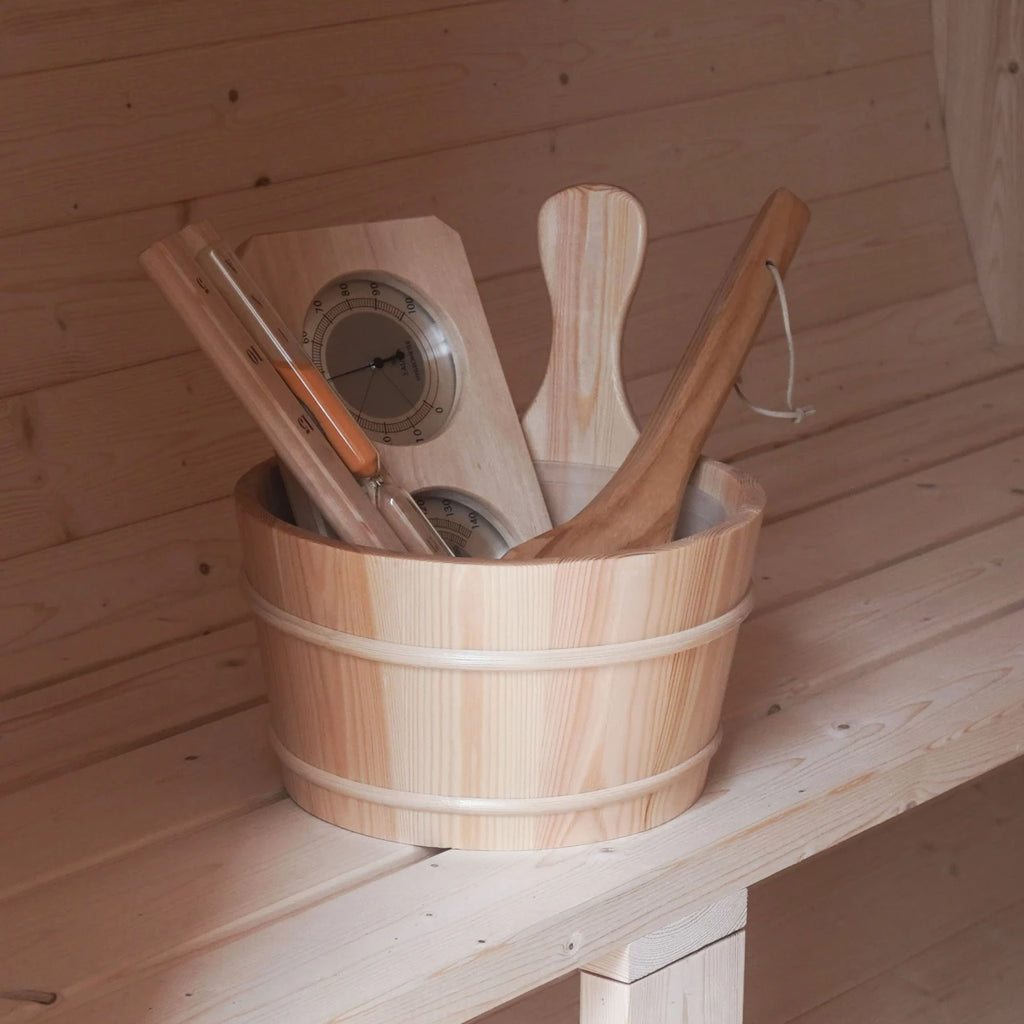 Wooden bucket with sauna tools on a wooden shelf in a sauna setting