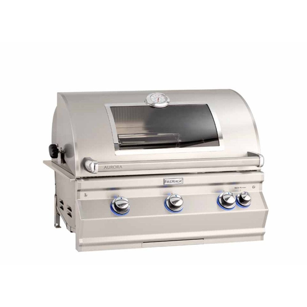 A stainless steel built-in gas grill with a curved lid, glass window, three control knobs with blue accents, and a temperature gauge on top, shown on a plain white background.
