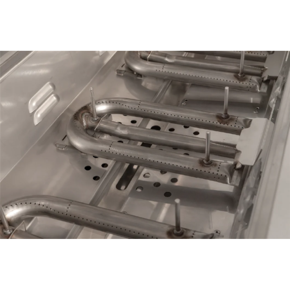 Close-up of a stainless steel gas range burner assembly with curved metal burners and mounting bolts inside a metallic oven or stove chamber.